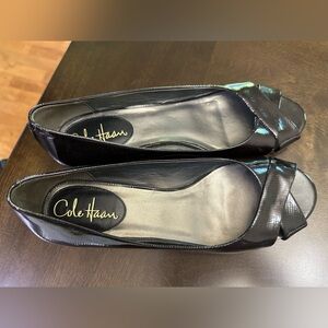 New black Cole Haan slip on dress shoe. Patent leather, small wedge. Never worn